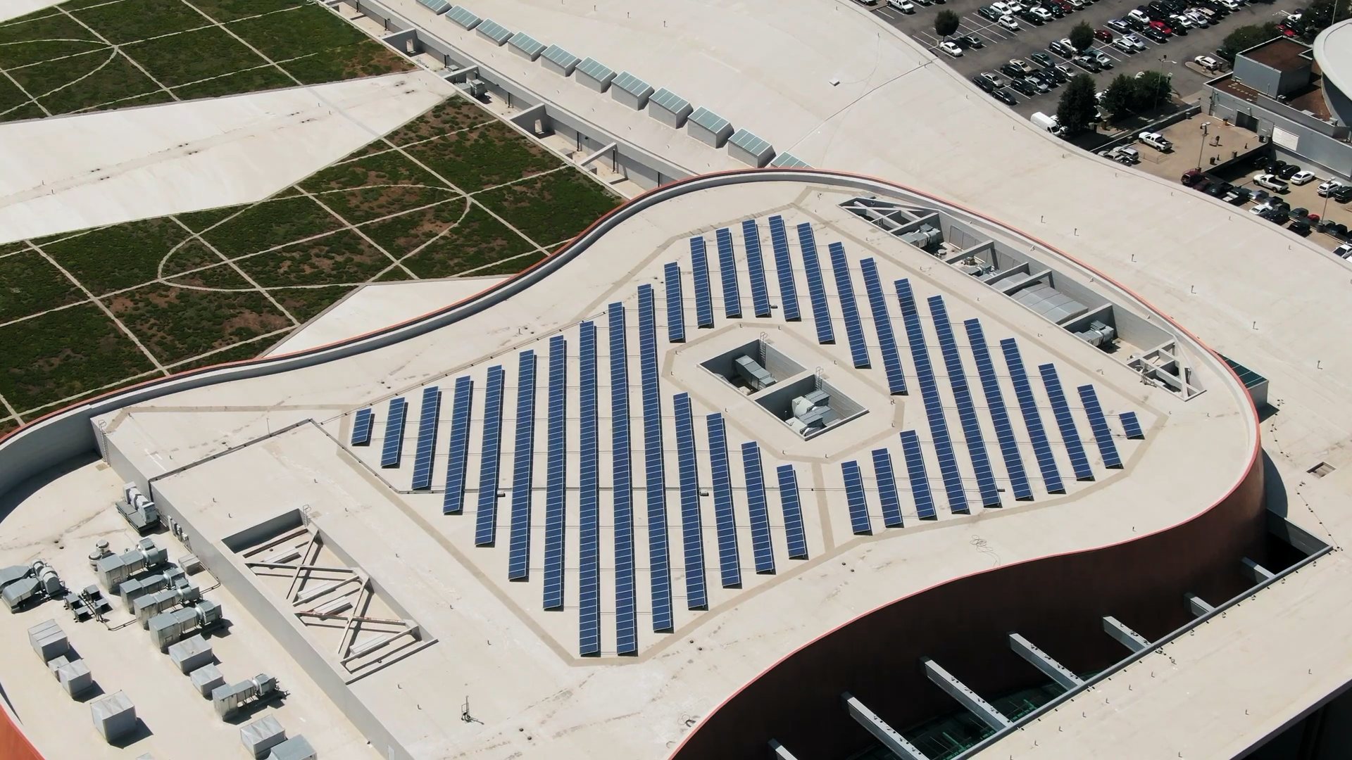 Aerial view of a large commercial rooftop solar array