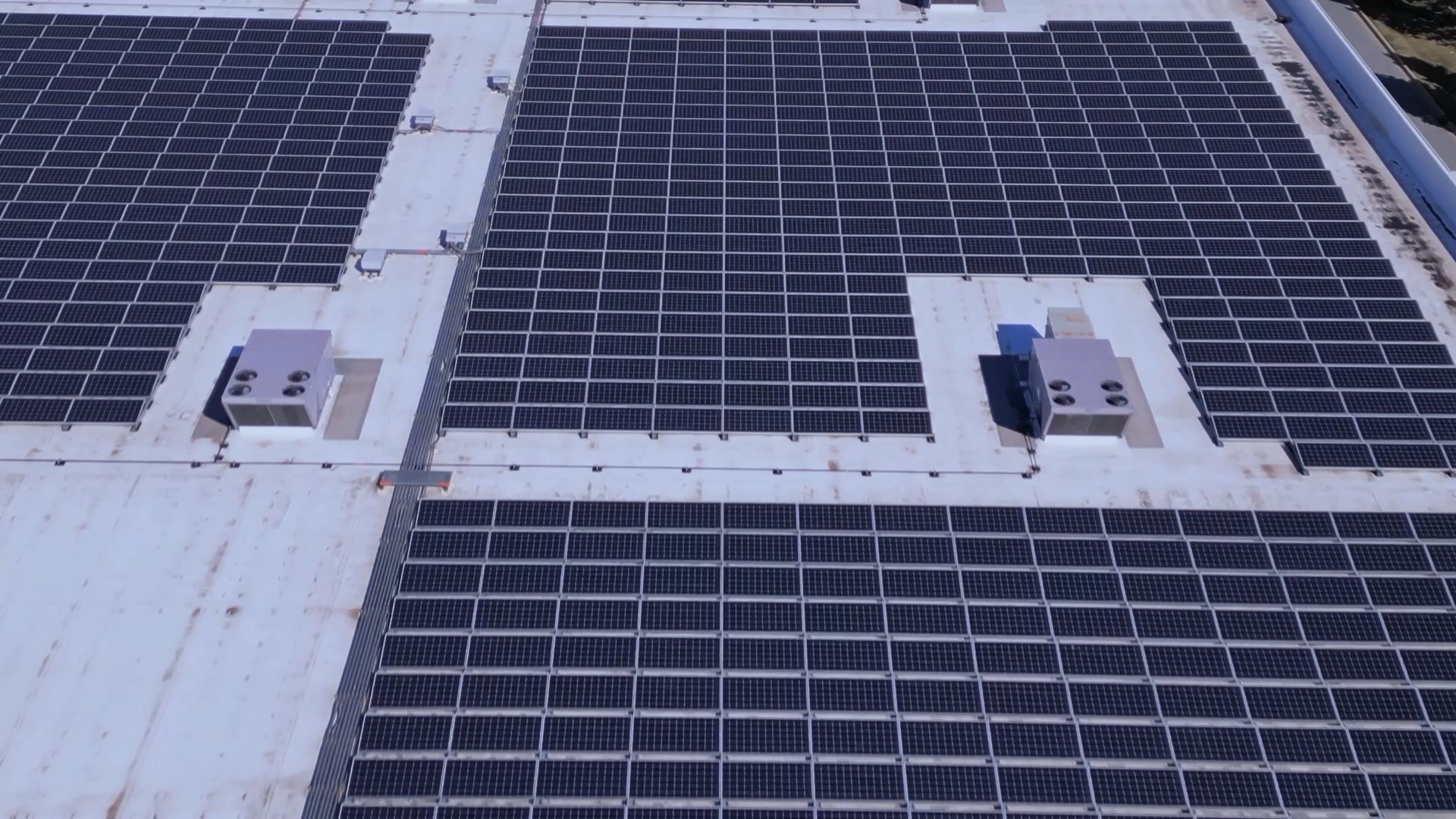 Aerial of a commercial rooftop solar installation